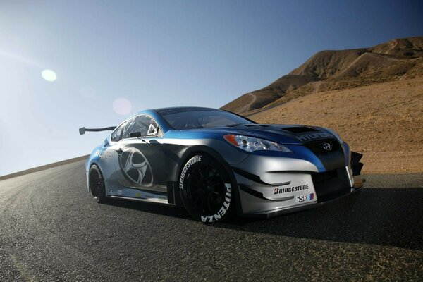 Sports powerful car on the background of a sand dune