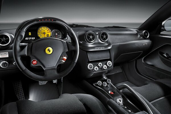 The interior of the car is black with a yellow accent