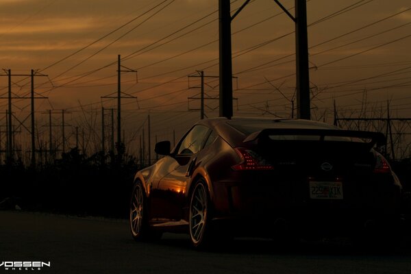 A powerful car in the thick twilight