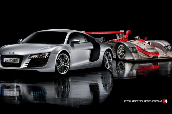 Silver Audi sedan and sports car