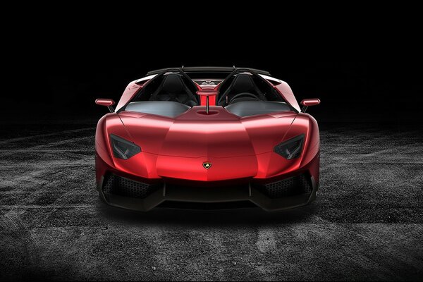 Un auto di colore rosso è in mostra