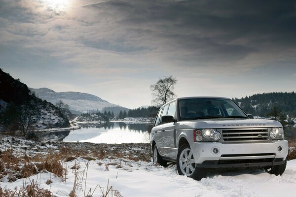 Off-road car at a winter location in the mountains