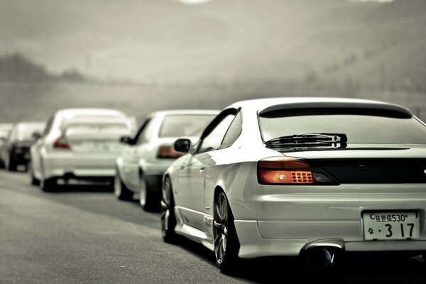 Cars the color of wet asphalt