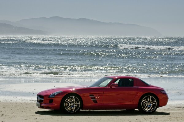 Red car on the background of the sea