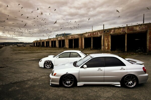 Two cars in a dark city