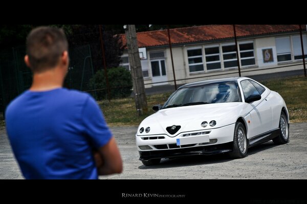 A man evaluates his new car