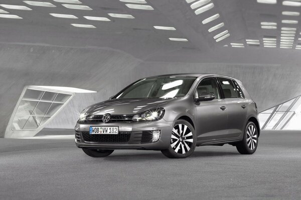 A black-and-white snapshot of a Volkswagen car