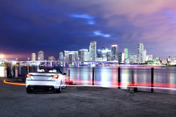 A car on the background of a beautiful city