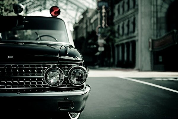 Urban landscape with an old car