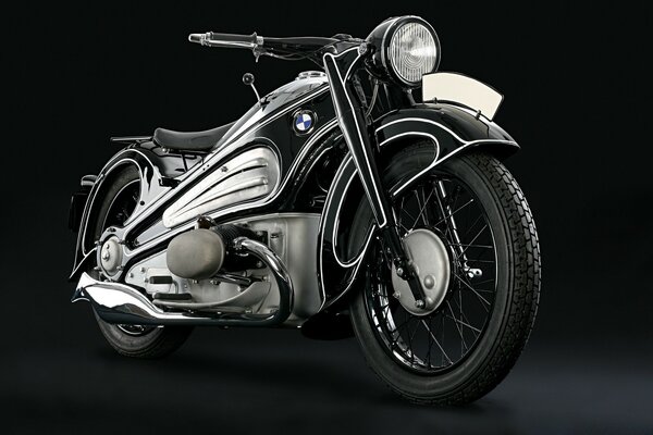 A silver-colored motorcycle on a black background