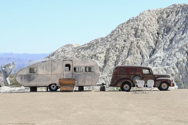 Vacation in the snowy mountains on retro cars