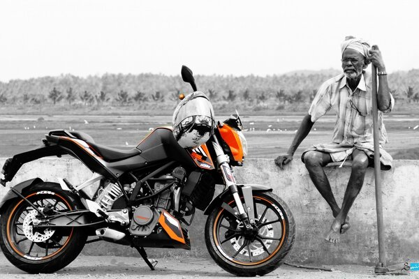 An old biker and his cool motorcycle