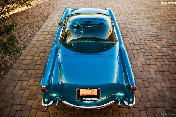 Blue retro car on the pavement