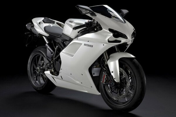 White motorcycle on a black background