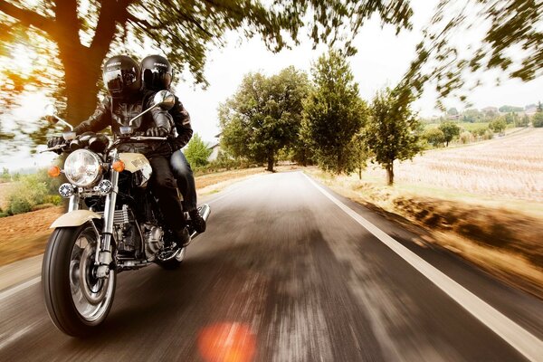 The motorcycle rushes along the road at speed