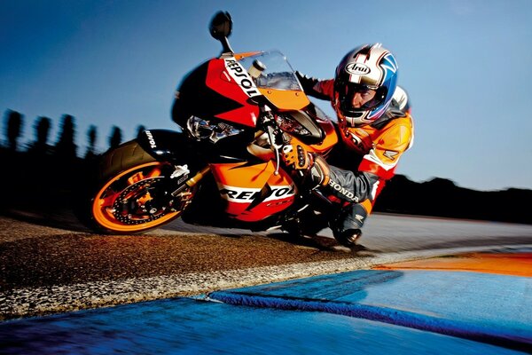 A motorcyclist rides near the water