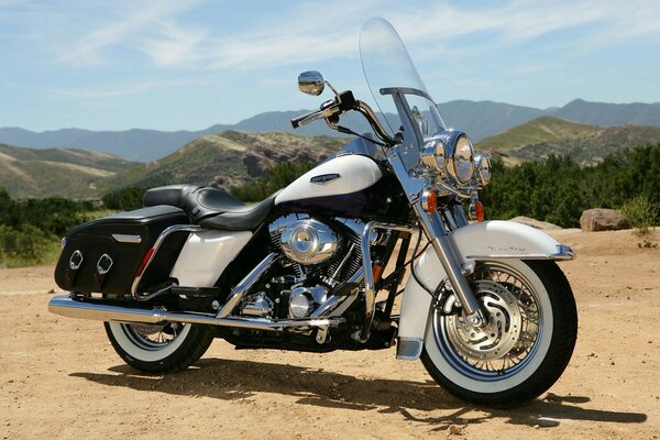 Motorcycle among sand and mountains