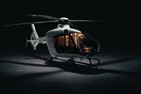 White helicopter on a black background