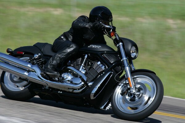 A racing motorcycle rushes along the highway