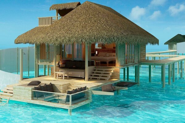 A house on stilts in the middle of the ocean. Tropical resort