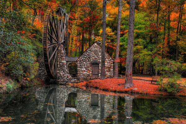 Stone house on the river bank. Beautiful landscape