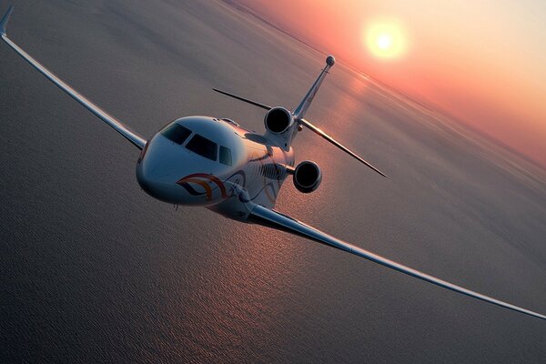 Private jet over the sea surface