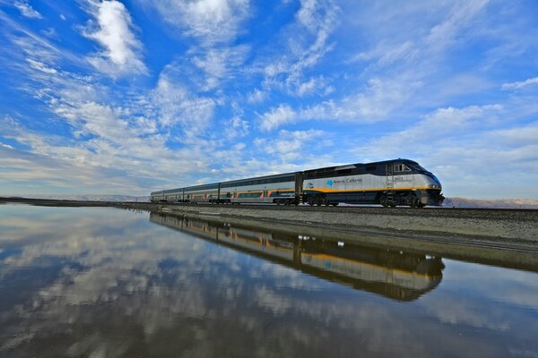 The train rides on rails in the water