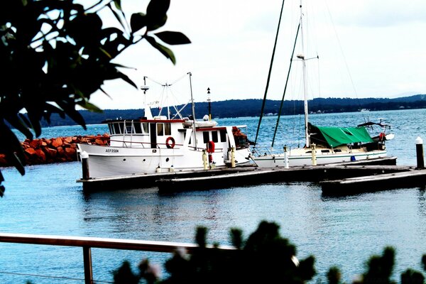 Boats and yachts on a sea background