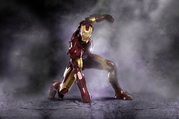 Iron Man landed, breaking the asphalt