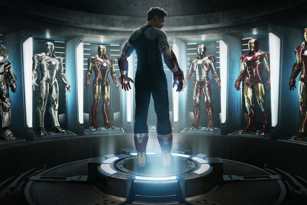 Iron Man surrounded by costumes