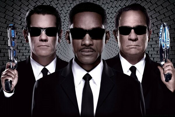 Three men in black jackets