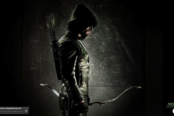 A hooded man with a bow and arrow