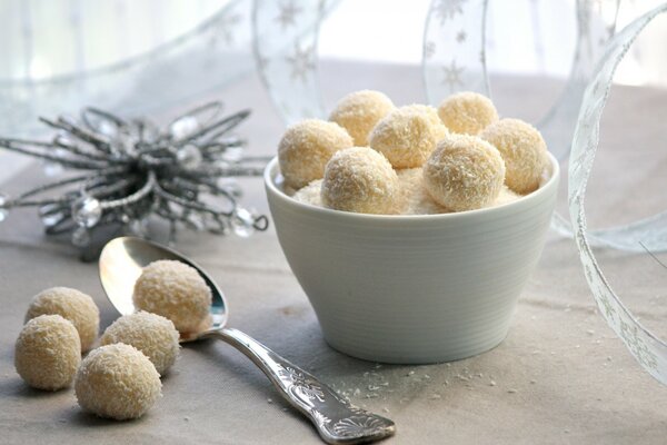 Homemade raffaello in a plate with a spoon