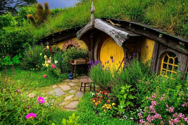 Squat house-dugout with grass on the roof