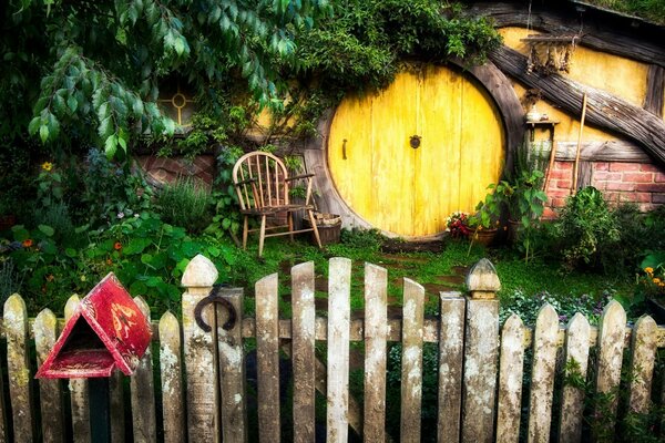 Cozy house with a round yellow door