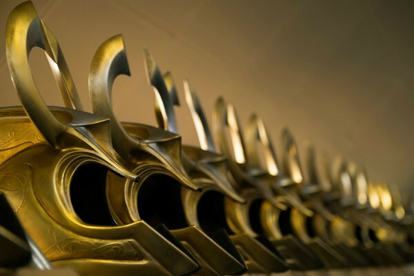 Gold helmets lined up in a row