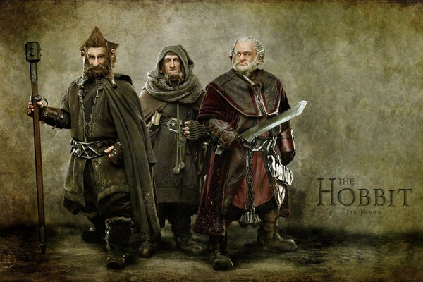 Three men in knight s armor with weapons