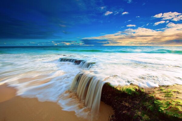 A beautiful waterfall with a beautiful sky