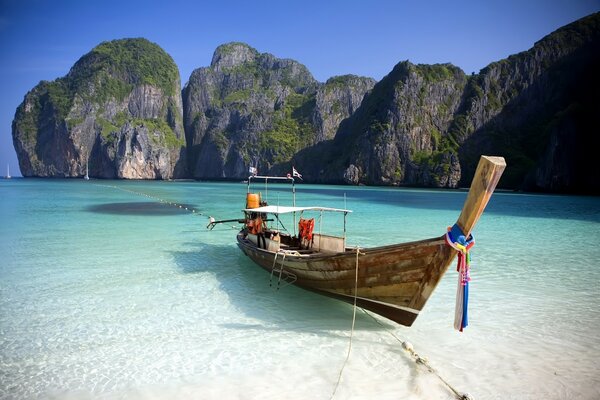 Wooden boat near the shore on the water