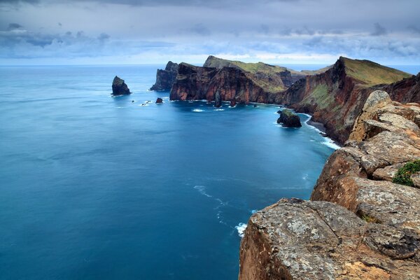 Beautiful rocks on the background of the blue sea