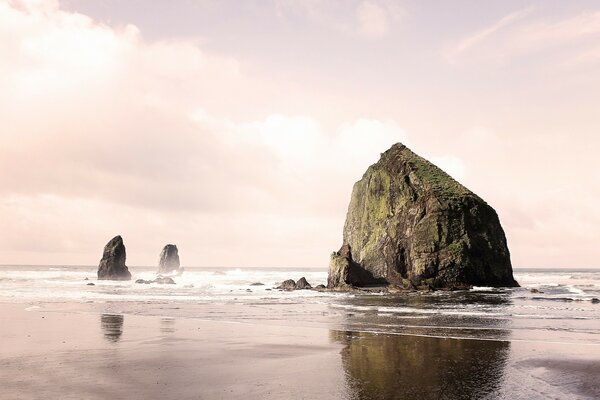 A big rock on the beach. ocean shore