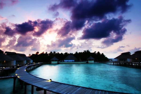 Swimming pool with blue water. The clouds