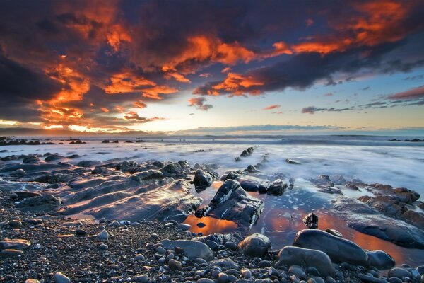 A quiet beach under leaden clouds