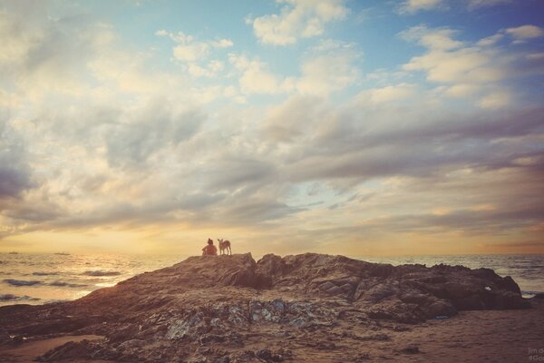 A girl meets the dawn on the seashore