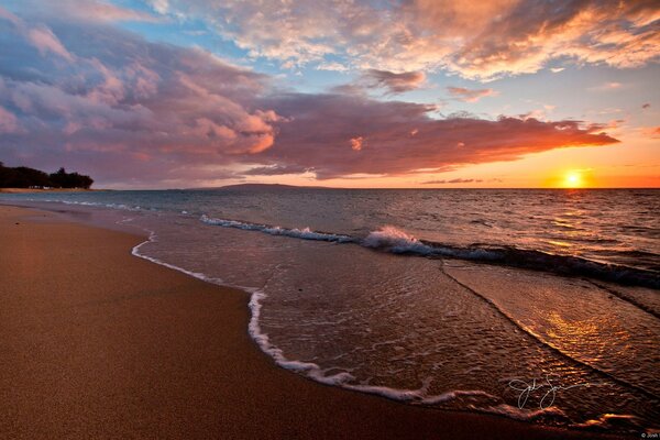 Evening sunset on the beach by the sea