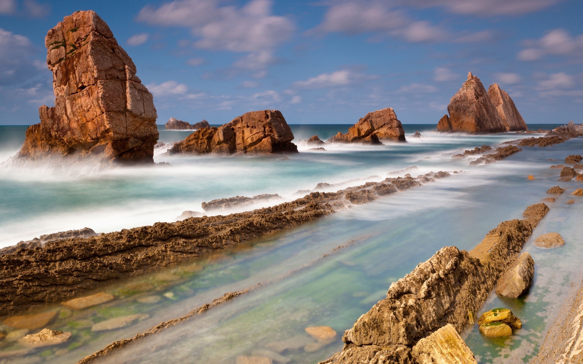 sea and ocean travel water seashore rock sea beach sky ocean landscape nature outdoors scenic sand surf cliff sunset seascape summer