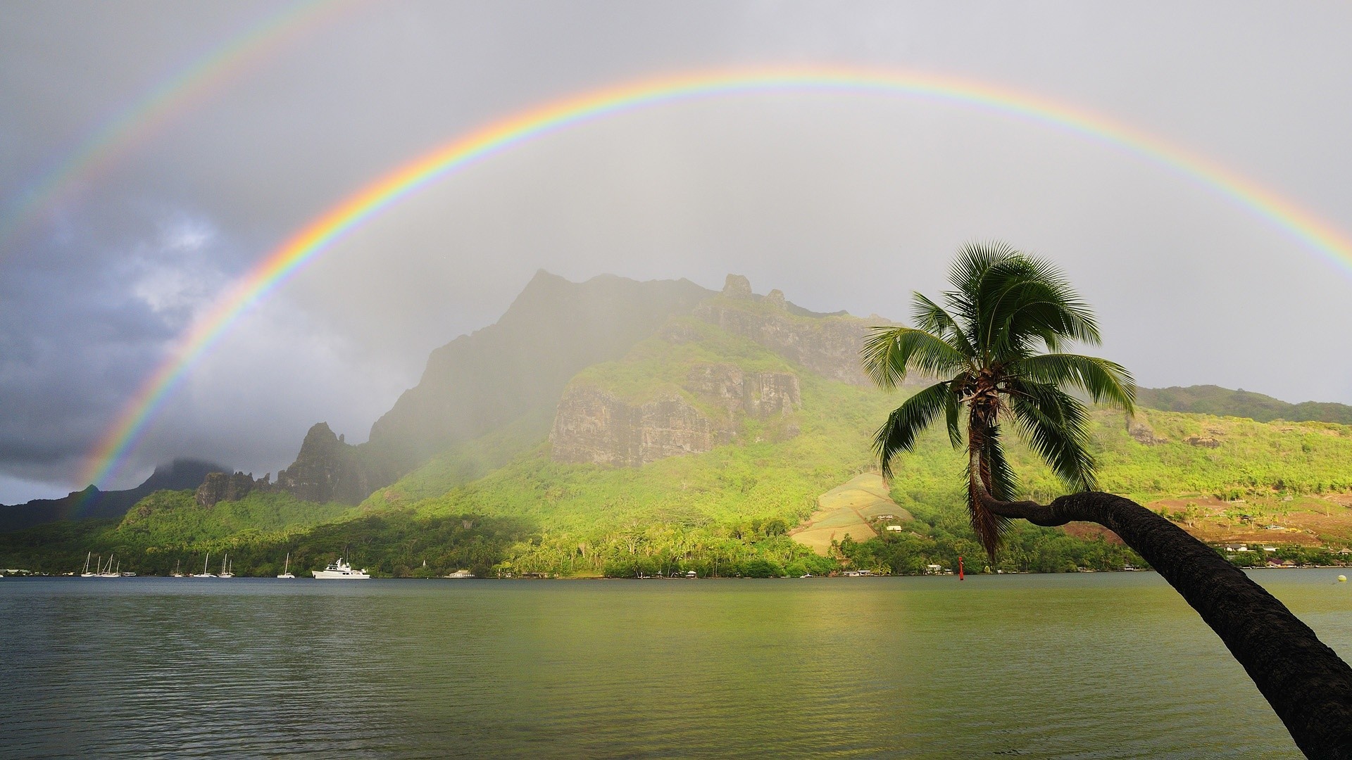 meer und ozean regenbogen landschaft baum wasser see reflexion strand natur berge himmel insel landschaftlich reisen sommer ozean meer wolke fluss sturm