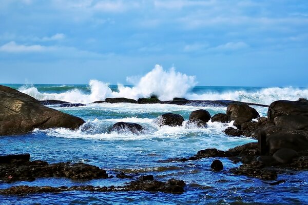 Sea waves crashing on rocks