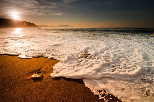 Beautiful sunset and sea foam