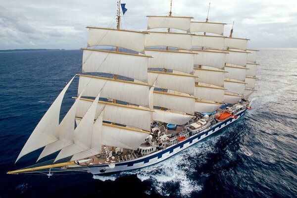 Snow-white sails of a ship in the open sea